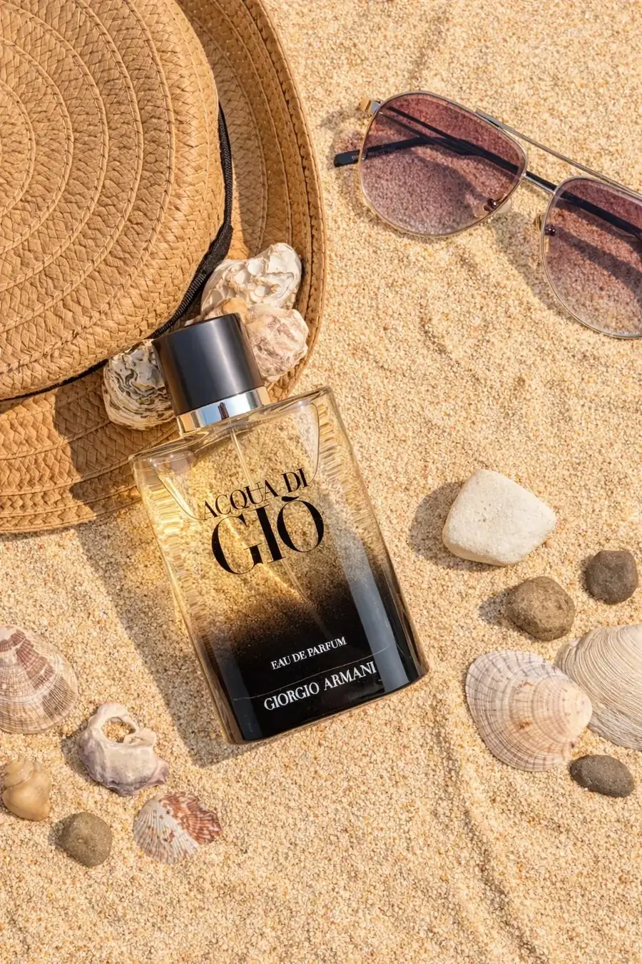 Men's designer perfumes and fragrance samples collection Giorgio Armani Acqua di Gio Eau de Parfum perfume bottle on sand background
